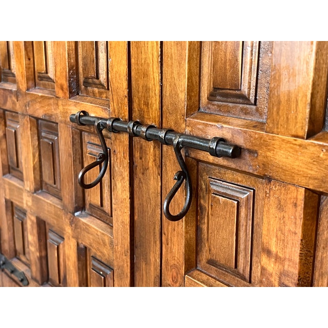 From Northern Spain, constructed of solid walnut, the rectangular top with molded edge atop a conforming case housing two...