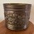 This vintage brass planter/jardiniere with claw feet features intricate grape and vine clusters, adding a touch of...