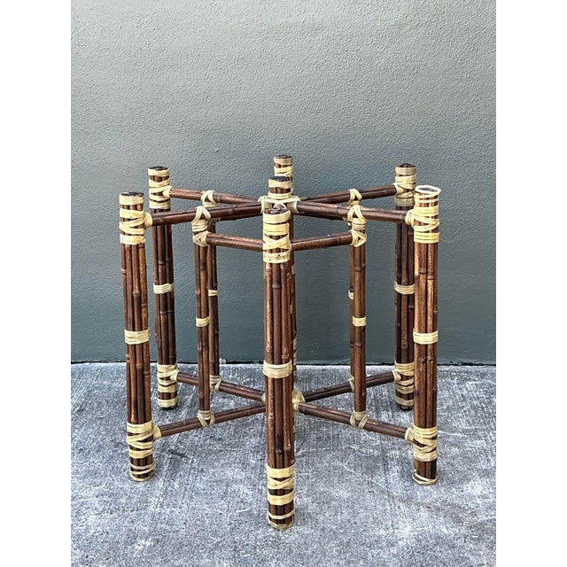 Elevate your dining space with this sophisticated vintage bundled rattan table base, a masterwork of organic texture and...