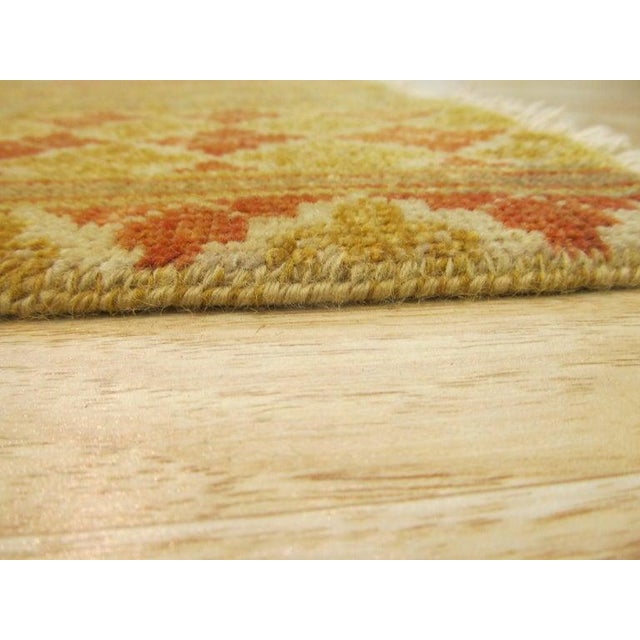 This hand knotted pile rug from India features a multicolor jewel tone palette and is crafted from durable wool. Designed...