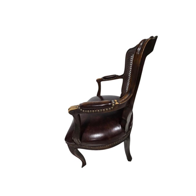 This elegant pair of French inspired armchairs offers timeless appeal. The curved frames showcase caned backs and deep...