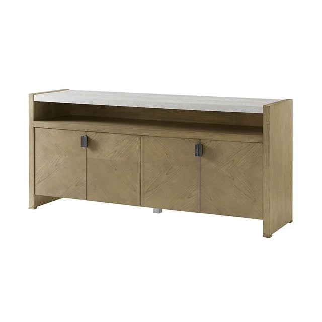 a four-door media cabinet in figured cathedral ash in an artful grain pattern in our light Dune finish. Completed with...