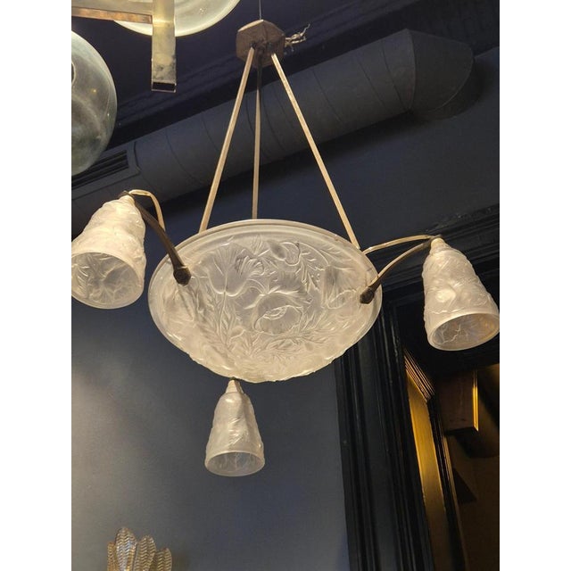 A rare Art Nouveau Chandelier glass shades with decor of poppies. Three arms, base in nickel plated metal. 4 e14 sockets....