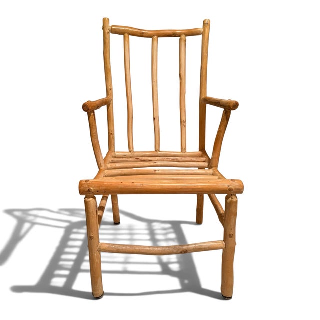 A set of five handmade dining chairs from Colorado. Slat backs and seats with angled arms and stretchers. Chairs come with...