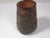 Handmade pottery cylindrical shaped vase, decorated with incised Aztec patterns. This chestnut brown vase has a glazed and...