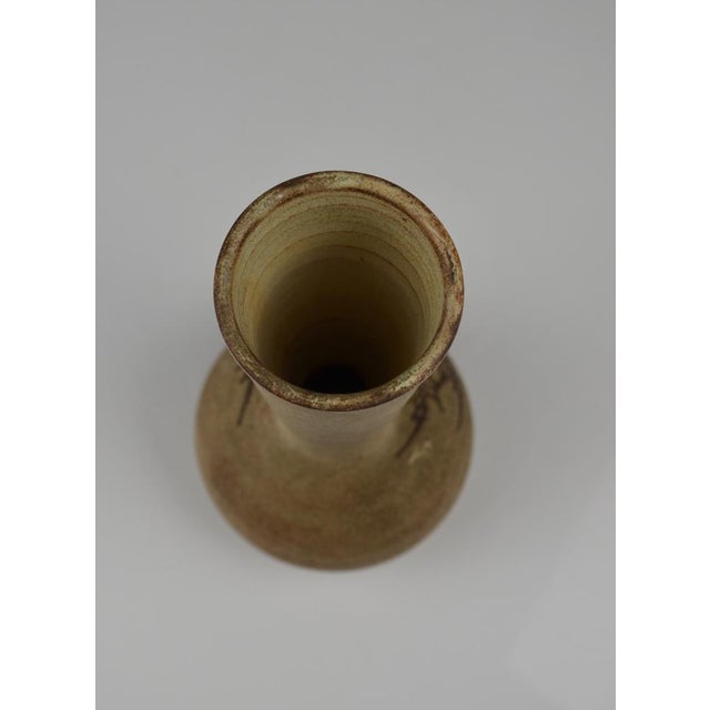 A pretty little ceramic vase attributed to Jacques Fonck & Jean Mateo, made in Vallauris, France. It features a thistle...