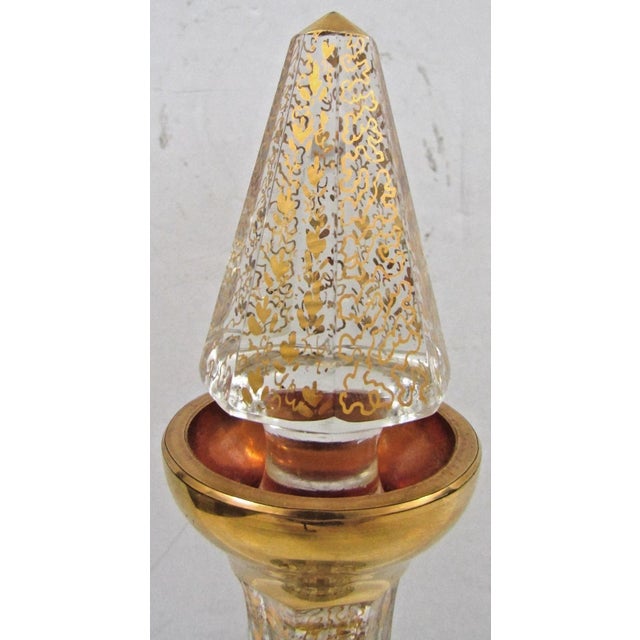 This Moser Black Paneled and Gold Fleck Cut Crystal Wine Decanter Carafe is a stunning piece of barware that exudes...
