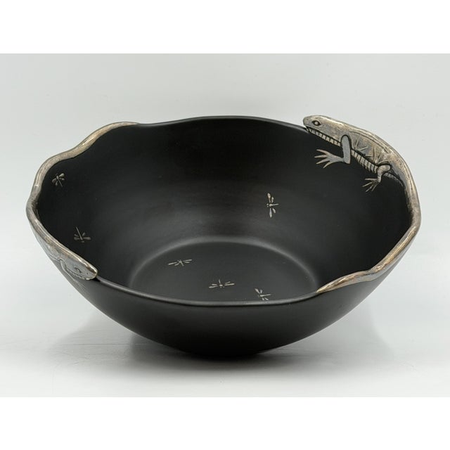 A striking 1980s Mexican Modernist decorative bowl by Emilia Castillo, handcrafted in Taxco, Mexico, combining deep matte-...