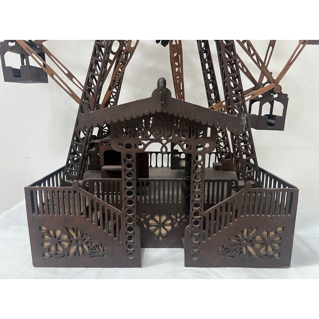 Model of a ferris wheel in carved wood bearing the inscription "oskar spendel" on the front wear and minor losses, see...