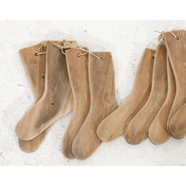 Charming set of 15 wooden socks decorations, 19th century h. 43 w. 12 d. 2 cm h. 16.9 w. 4.7 d. 0.7 in