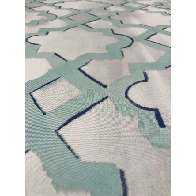 This multipurpose fabric has a classic ogee pattern in turquoise and navy on a mottled silver and white basecloth. The...