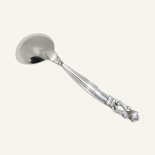 In 1917 Johan Rohde designed the Acorn pattern for the Georg Jensen studio. This sauce ladle is a serving piece from the...
