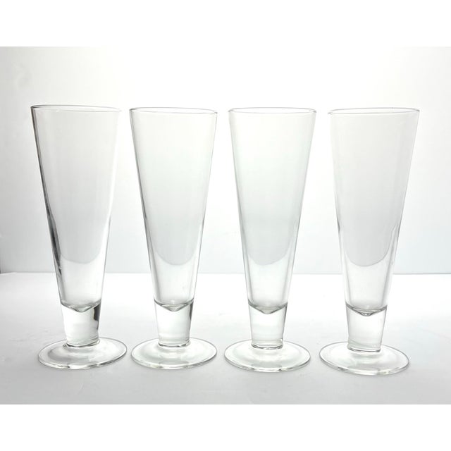 Crate & Barrel 4 Footed Beer Pilsner or Fluted Champagne Glasses 9” 16oz Excellent condition. No chips, cracks, or...