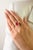 This timeless three-stone ring feature 1 oval cut natural ruby weighing 3.19 carats, set in 14k yellow gold. The ruby...