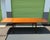 A refined Danish modern extension dining table produced by Gudme Møbelfabrik in the 1970s, crafted in warm teak with...