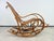 Large Thonet rocking chair no.7021B in excellent structural condition. The rattan cane is mostly tight and intact, with...