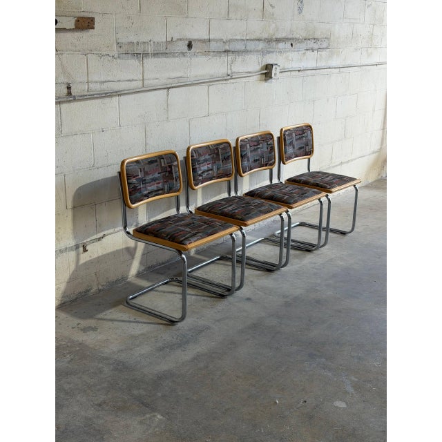 Stylish set of 4 vintage Cesca-style cantilever dining chairs in style of Marcel Breuer. These Italian chairs feature...