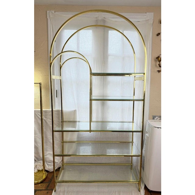 Mid Century Modern Brass Etagere in the style of Milo Baughman. Nice dome shaped top with 5 glass shelves. Perfect for...