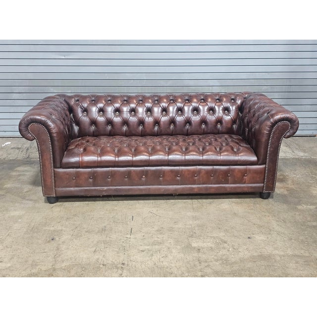 Store Item: English Brown Tufted Leather Chesterfield Sofa Description: Classic English made Chesterfield sofa featuring...