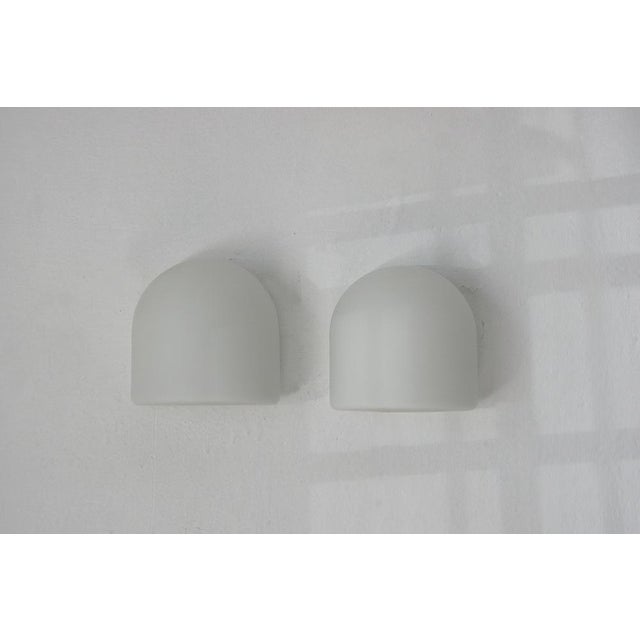 Subtle, elegant, timeless – these wall lamps manufactured by Staff Leuchten are a tribute to pure form and light. Made of...