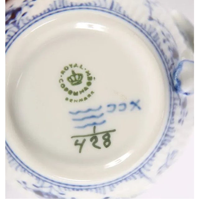 Elegant Royal Copenhagen Blue Fluted sugar bowl with twin handles, pattern #428. This classic piece features the iconic...