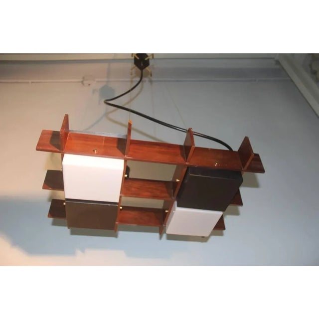 This ceiling lamp was designed by Oscar Torlasco for Esperia in the 1960s. The supporting structure is made of wood with...