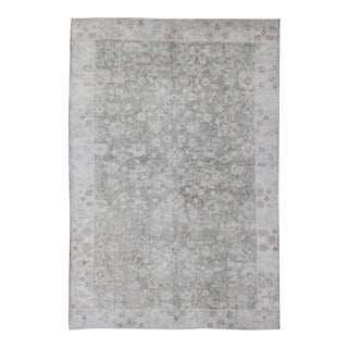 1930's Vintage Turkish Muted Oushak With All-Over Floral Design and Border For Sale