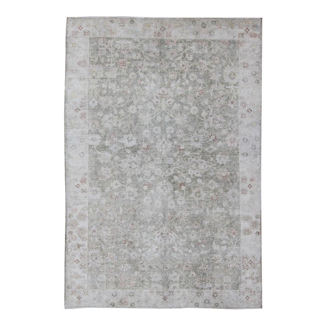 1930's Vintage Turkish Muted Oushak With All-Over Floral Design and Border For Sale