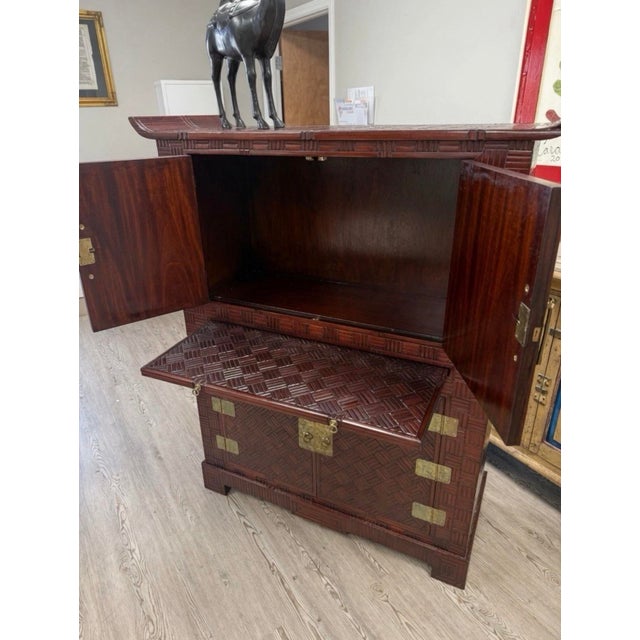The Vintage Maitland And Glascoe Style Chinoiserie Parquet Bamboo Bar Cabinet is a unique and stylish piece of furniture...