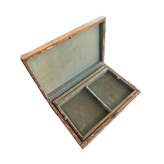 Wooden hinged box with white and gold paint and etched details. The interior is light green. This box is perfect for small...