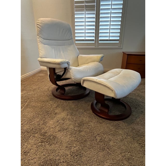 The iconic Stressless lounge chair and matching ottoman in White Leather and Rosewood by Ekornes represent the pinnacle of...