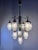 This 10-light chandelier by richard essig is an impressive lighting fixture that effortlessly bridges the gap between...