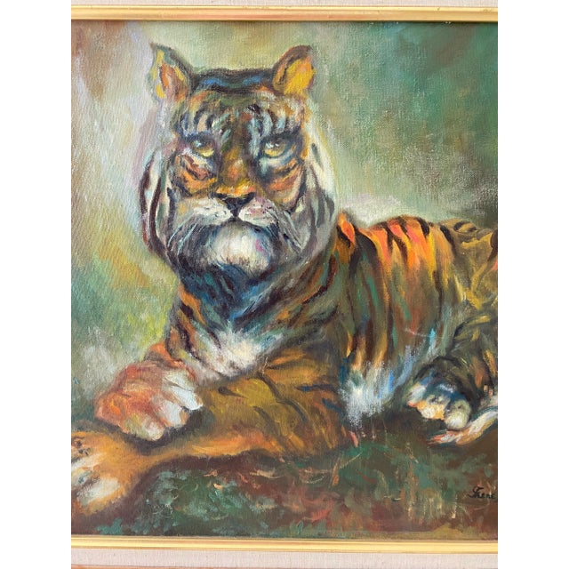 1977 oil painting of a majestic Tiger. Fall colors predominate with a faux bamboo brushed gold frame. Signed by the artist