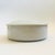 A vintage circular ceramic lidded box. Finished in a glossy white glaze. Nice minimalist design, perfect for using as...