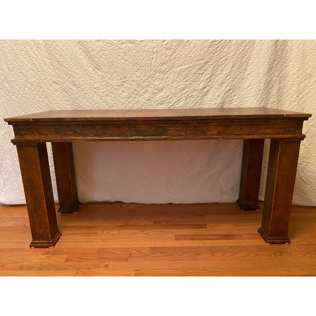 With robust classic lines of textured parchment and solid brass fittings, this rare to the market Hart console provides...