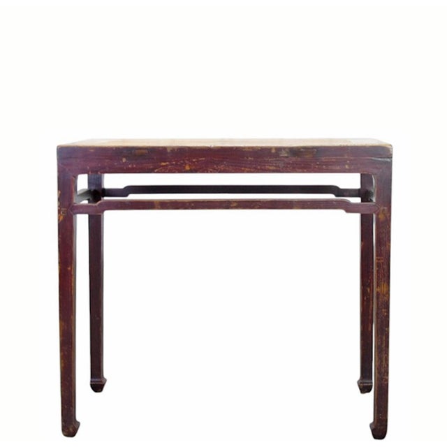 This rectangular console table features a traditional square-corner construction with a natural elm wood top set into a...