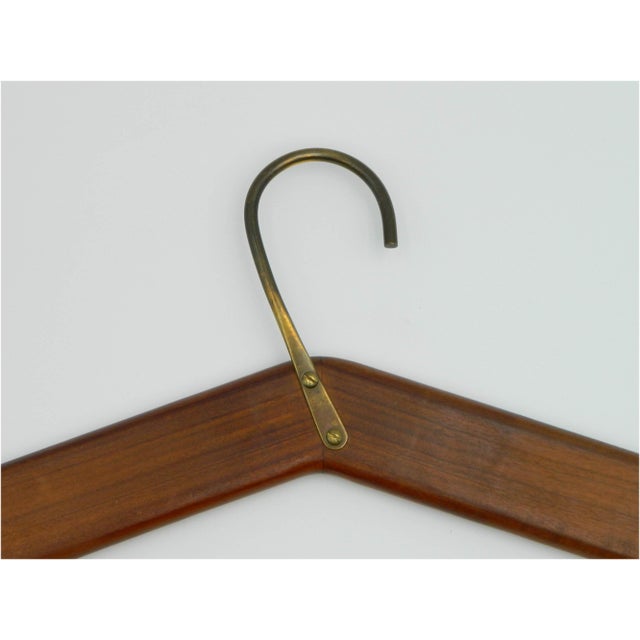 Beautiful pair of clothes hangers made of walnut wood model 4650 from the Carl Auböck Vienna workshop. Each consists of...