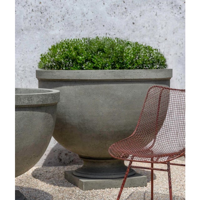 A simple planter set on a square base, in an Alpine Stone finish. Available in large and small versions. This listing is...