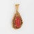 Finely detailed vintage red coral pendant crafted in 14k yellow gold (circa 1970s). Cabochon cut coral measures 18mm x...