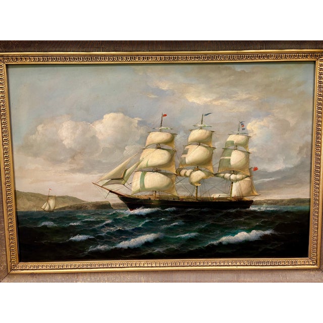 Simply stunning oil painting of a three-masted clipper ship unfurling sails into the wind in an ornate gilded frame....