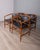 Set of four chairs with teak frame and black leather seat, designed by ISA Bergamo, 1960s. This piece has an attribution...