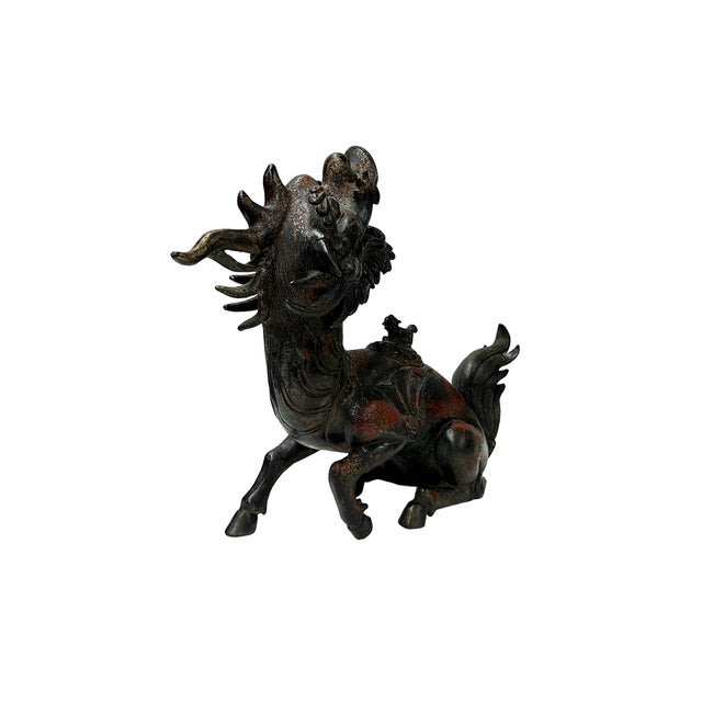 Crafted with exquisite traditional detail, this striking vintage bronze-tone incense burner depicts a mythical Kirin in a...