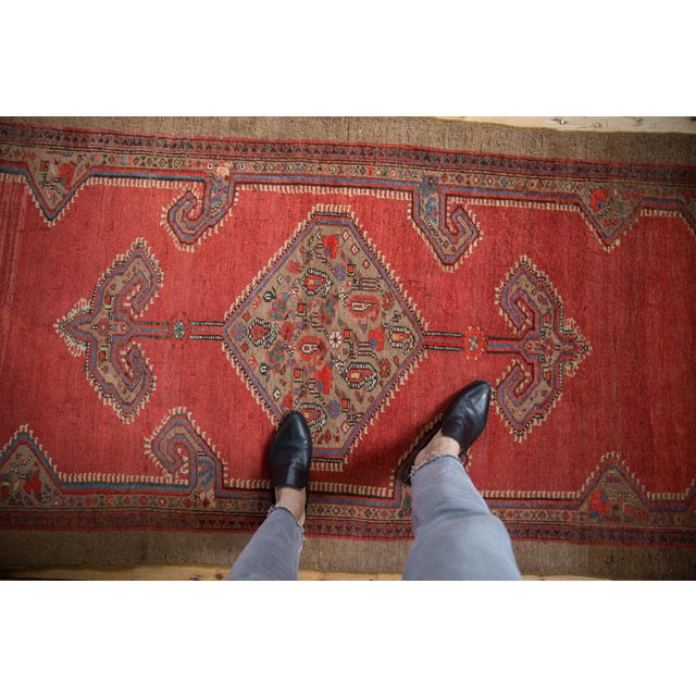 :: Hexagonal center medallion with interior botehs interconnected by checkered vines. Adorned at either opposing end by...