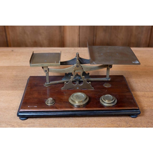 This finely crafted Early 20th Century English postal scale is a striking example of the functional yet elegant design...