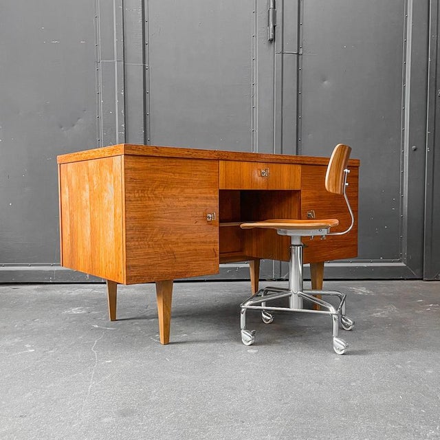 Product: desk style: mid-century · 1960s material: walnut veneer features: two doors · drawer on the left · shelf on the...
