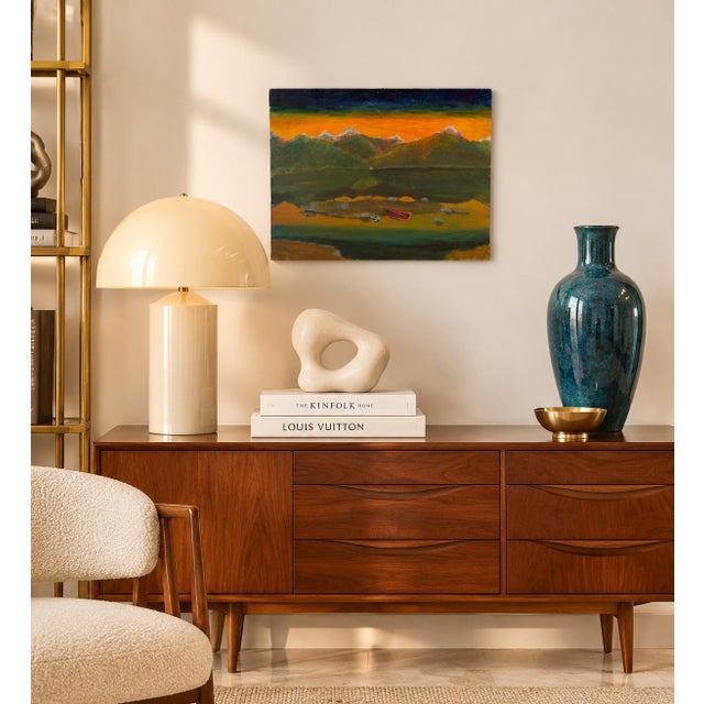 Charming vintage oil on canvas depicting a peaceful mountain landscape at sunset, featuring snow-capped peaks, a tranquil...