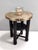 Made in Austria, 1920s. This coffee table features a durmast frame with a brass top and a shelf. This is a vintage piece,...