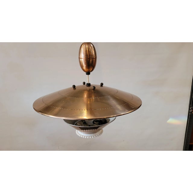 A wonderful adjustable chandelier made in Denmark by Artolier 1960's and in perfect working order. Pulls up and down for...