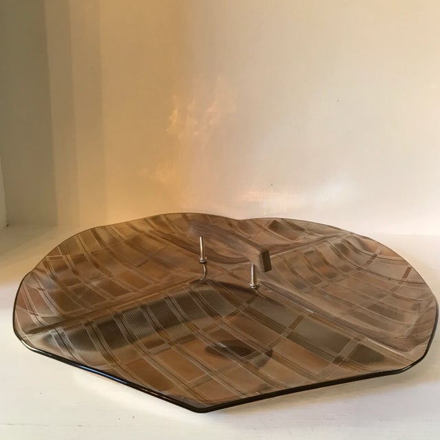 This is one of those trays that changes and reflects the gold color when moved. It is an unusual shape with a gold tight...