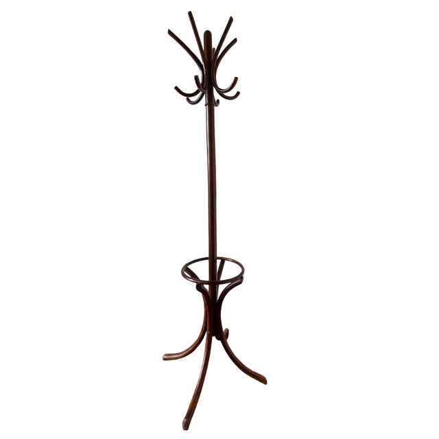 An icon of Belle Époque design, where elegance meets timeless utility. A refined bentwood coat stand, known as the...
